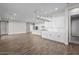 Expansive living area with stylish flooring, recessed lighting and white trim at 12312 W Luxton Ln, Avondale, AZ 85323