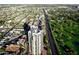 This aerial view displays the building's rooftop with a golf course running alongside a residential neighborhood at 1040 E Osborn Rd # 302, Phoenix, AZ 85014