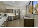 Modern kitchen featuring stainless steel appliances, granite countertops, and ample cabinet space at 1040 E Osborn Rd # 302, Phoenix, AZ 85014