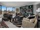Sophisticated living room with ample seating and a large bookcase at 1040 E Osborn Rd # 302, Phoenix, AZ 85014
