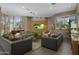 Bright living room with large windows, comfortable seating, and modern entertainment center at 1040 E Osborn Rd # 302, Phoenix, AZ 85014
