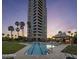 Resort-style pool and building exterior at sunset at 1040 E Osborn Rd # 302, Phoenix, AZ 85014
