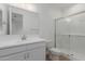 Modern bathroom with shower, sink, and vanity at 19565 W Cambridge Ave, Buckeye, AZ 85396