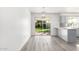 Bright dining area with sliding doors leading to the backyard at 9911 W Pleasant Valley Rd, Sun City, AZ 85351