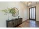 Welcoming entryway with decorative flooring, stylish mirror, and modern light fixture at 3965 E Sierra Vista Dr, Paradise Valley, AZ 85253