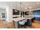 Bright kitchen featuring granite countertops, stainless steel appliances, and wood floors at 3965 E Sierra Vista Dr, Paradise Valley, AZ 85253