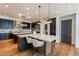 Gourmet kitchen with dark cabinets, granite countertops, and stainless steel appliances at 3965 E Sierra Vista Dr, Paradise Valley, AZ 85253