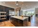 Spacious kitchen with stainless steel appliances, granite countertops, and hardwood floors at 3965 E Sierra Vista Dr, Paradise Valley, AZ 85253
