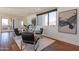 Bright living room boasts hardwood floors, glass table, modern decor, and large windows with scenic views at 3965 E Sierra Vista Dr, Paradise Valley, AZ 85253