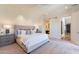 Bright main bedroom features a sliding barn door to the bathroom and neutral decor at 3965 E Sierra Vista Dr, Paradise Valley, AZ 85253