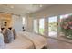 Bright main bedroom with direct access to an outdoor patio and garden area at 3965 E Sierra Vista Dr, Paradise Valley, AZ 85253