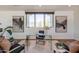 Upstairs office features a glass desk, hardwood flooring, and modern decor at 3965 E Sierra Vista Dr, Paradise Valley, AZ 85253