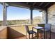 Private balcony with mountain views and seating for two at 10287 E Diamond Rim Dr, Scottsdale, AZ 85255