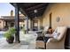 Relaxing covered patio with comfortable seating near the pool at 10287 E Diamond Rim Dr, Scottsdale, AZ 85255