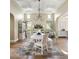 Bright dining room with a spacious table and stunning chandelier at 10287 E Diamond Rim Dr, Scottsdale, AZ 85255