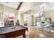 Game room with a pool table and access to a courtyard at 10287 E Diamond Rim Dr, Scottsdale, AZ 85255