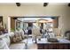 Living room with sliding doors opening to a private courtyard at 10287 E Diamond Rim Dr, Scottsdale, AZ 85255