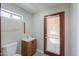 Bright bathroom with vanity, wood cabinet, and natural light at 2119 N Lake Shore Dr, Casa Grande, AZ 85122
