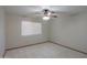 Bedroom featuring neutral carpet, ample wall space and a ceiling fan at 2119 N Lake Shore Dr, Casa Grande, AZ 85122