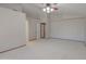 Large open bedroom with wood trim doorway and ceiling fan at 2119 N Lake Shore Dr, Casa Grande, AZ 85122