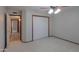 Bedroom features carpet, ceiling fan, and large closet at 2119 N Lake Shore Dr, Casa Grande, AZ 85122