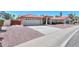 Lovely home with a red tile roof, two-car garage, and low-maintenance desert landscaping at 2119 N Lake Shore Dr, Casa Grande, AZ 85122