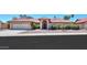 Charming home featuring a red tile roof, desert landscaping, and an arched entryway at 2119 N Lake Shore Dr, Casa Grande, AZ 85122