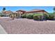 Attractive home featuring desert landscaping, a red tile roof, and arched entryway at 2119 N Lake Shore Dr, Casa Grande, AZ 85122