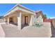 An exterior view of the home with a patio, pool and privacy fence at 2119 N Lake Shore Dr, Casa Grande, AZ 85122