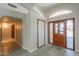 Entryway featuring tile flooring, high ceilings, and a decorative front door at 2119 N Lake Shore Dr, Casa Grande, AZ 85122