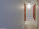 Hallway with fresh paint and wood-trimmed doorways at 2119 N Lake Shore Dr, Casa Grande, AZ 85122