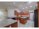 Modern kitchen with stainless steel appliances, granite countertops, and ample cabinet space at 2119 N Lake Shore Dr, Casa Grande, AZ 85122