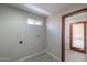 Laundry room with gray walls, utility hookups, and tile flooring at 2119 N Lake Shore Dr, Casa Grande, AZ 85122