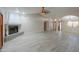 Bright living area with tile floors, fireplace, and arched doorways to adjoining rooms at 2119 N Lake Shore Dr, Casa Grande, AZ 85122