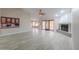 Open living space featuring tile floors, a fireplace, and a breakfast bar connecting to the kitchen at 2119 N Lake Shore Dr, Casa Grande, AZ 85122