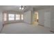 Spacious bedroom featuring carpet, ceiling fan, large windows, and ensuite bathroom at 2119 N Lake Shore Dr, Casa Grande, AZ 85122