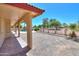 Large covered patio featuring brick pavers, offering a perfect outdoor living and entertaining space at 2119 N Lake Shore Dr, Casa Grande, AZ 85122