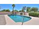 Inviting private pool with lush landscaping and a serene outdoor space, perfect for relaxation at 2119 N Lake Shore Dr, Casa Grande, AZ 85122