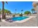 A beautiful pool with palm trees in the background at 2119 N Lake Shore Dr, Casa Grande, AZ 85122