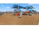 Community playground with modern equipment, offering a fun and safe recreational space for children at 37607 W Padilla St, Maricopa, AZ 85138