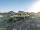 Custom home featuring desert landscape, mountain views, desert foliage, and tile roof at 10537 N Crestview Dr, Fountain Hills, AZ 85268