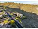 Luxury home with tile roof and circular design, surrounded by desert landscape and winding road at 10537 N Crestview Dr, Fountain Hills, AZ 85268
