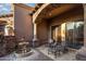 This back porch features a stone column, outdoor fountain, and seating area at 10537 N Crestview Dr, Fountain Hills, AZ 85268