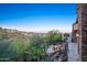 Picturesque backyard featuring a stone patio, fire pit, waterfall feature, and desert mountain views at 10537 N Crestview Dr, Fountain Hills, AZ 85268