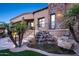 Stunning backyard includes a serene rock waterfall and lush desert landscaping for tranquil outdoor living at 10537 N Crestview Dr, Fountain Hills, AZ 85268