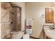 A functional bathroom featuring a tiled shower, toilet, towel rack, and a vanity at 10537 N Crestview Dr, Fountain Hills, AZ 85268