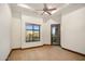 Bright bedroom featuring a ceiling fan, carpet and large window with an exterior view at 10537 N Crestview Dr, Fountain Hills, AZ 85268