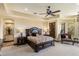 A lovely bedroom featuring a decorative ceiling, an elegant bed, and a comfortable armchair at 10537 N Crestview Dr, Fountain Hills, AZ 85268