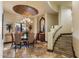 Elegant dining room with custom decor, chandelier, and access to a staircase at 10537 N Crestview Dr, Fountain Hills, AZ 85268