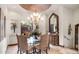 The formal dining room features a chandelier and large view windows at 10537 N Crestview Dr, Fountain Hills, AZ 85268